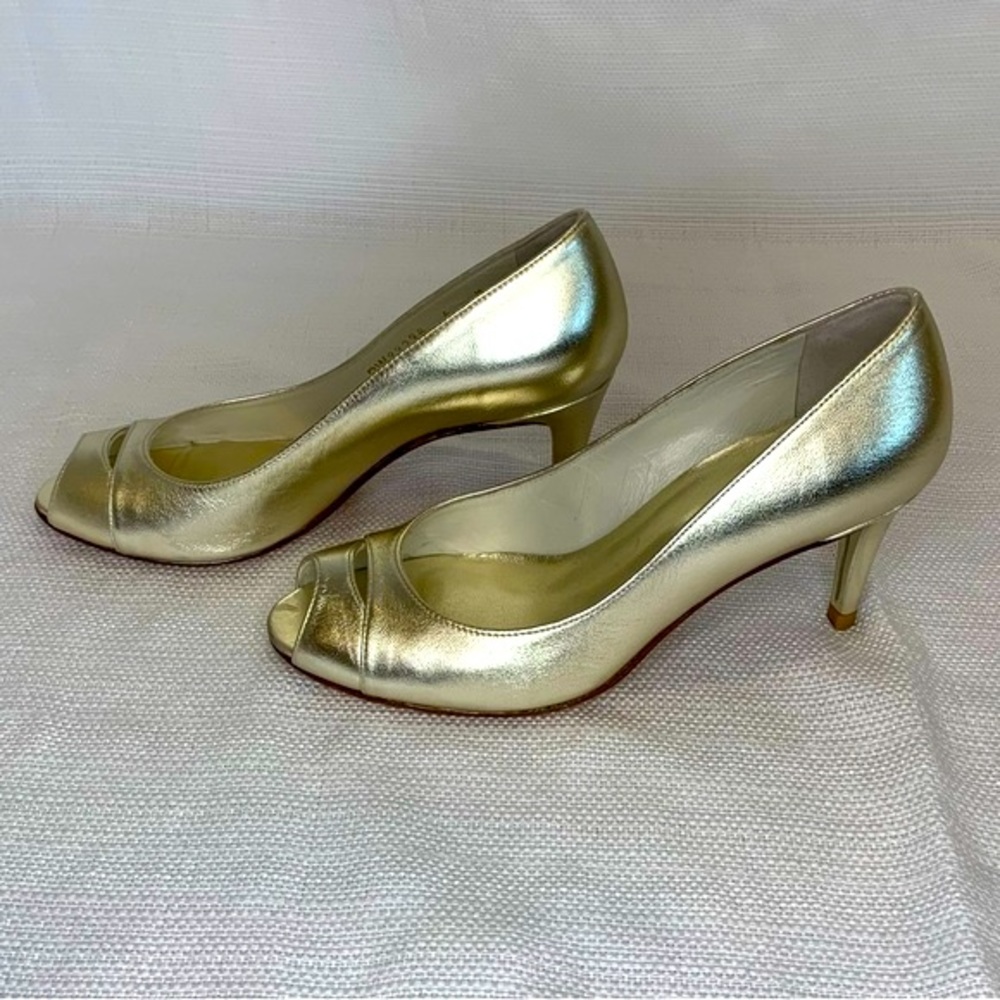 Stuart Weitzman gold leather peep toe pumps